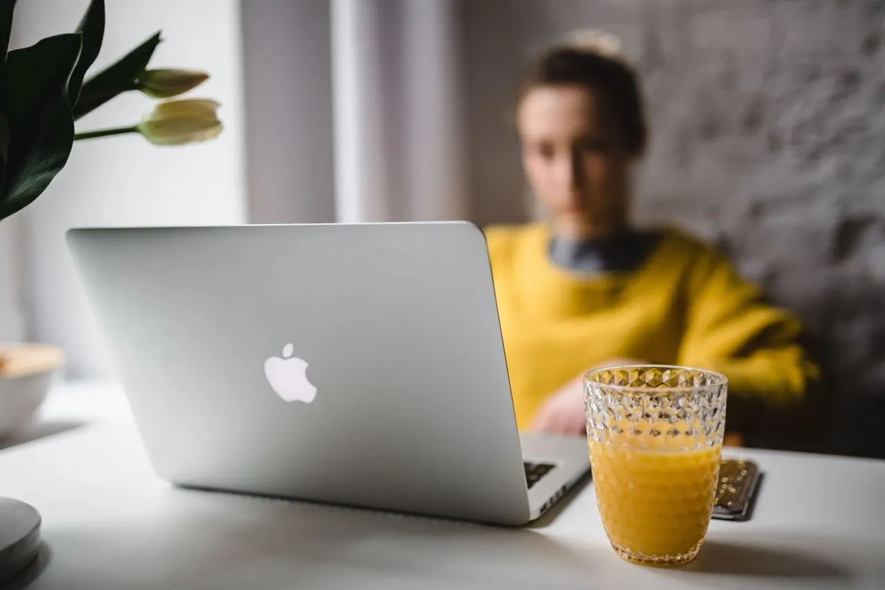 Business owner joining a video demo on her laptop